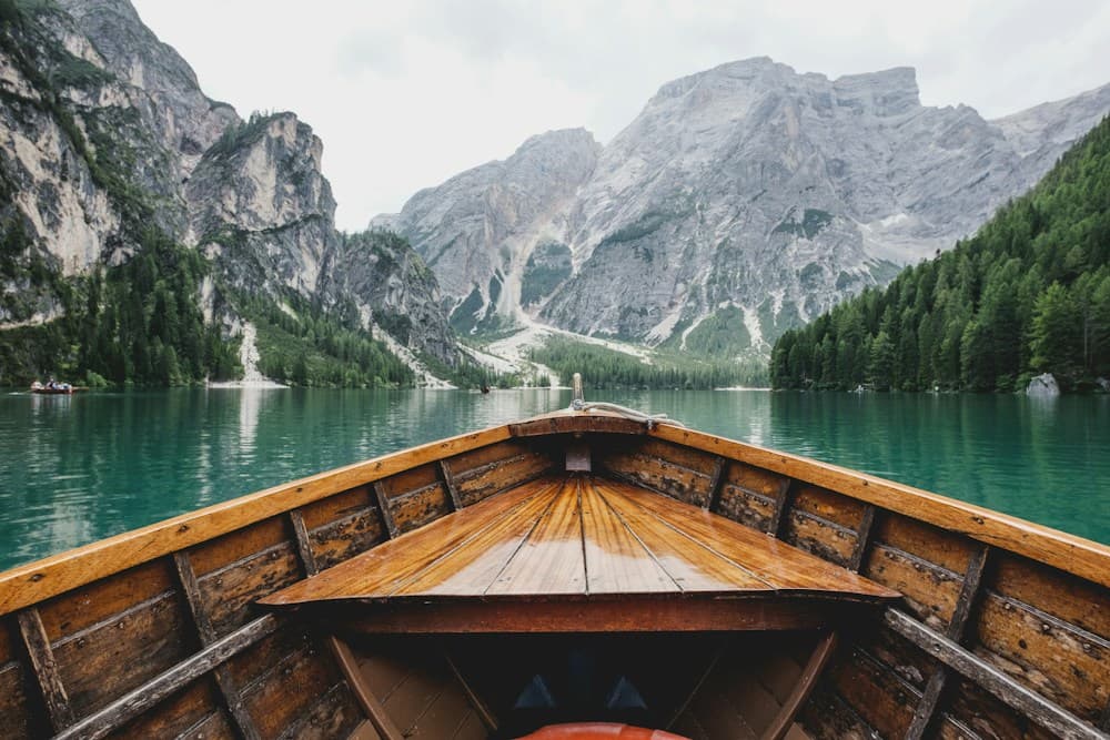 An alpine lake surrounded by misty mountains